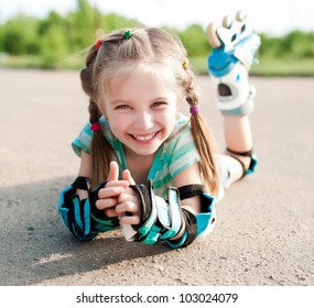 Little girl in roller skates at a park