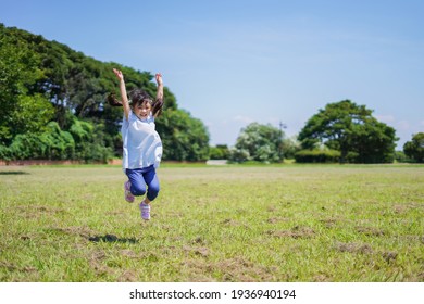 Little Girl Running Around Outside