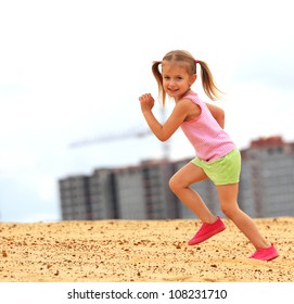 Little Girl Running In Sand