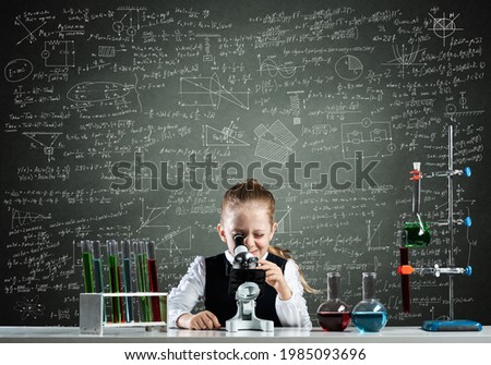 Similar – Image, Stock Photo Little boy looking at camera through magnifying glass