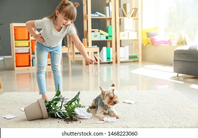 Little Girl Scolding Dog For Mess In Room