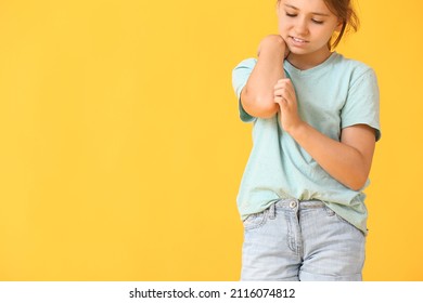 Little Girl Scratching Herself On Color Background