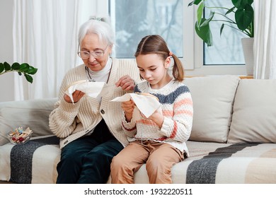 A little girl of seven years and her gray-haired grandmother of seventy years, together are passionate about embroidery. 