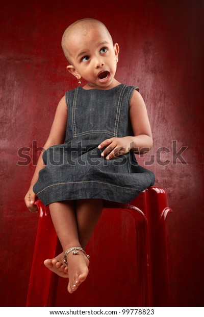 Little Girl Shaved Head Shows Gesture Stock Phot