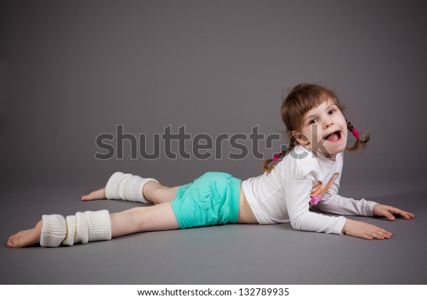 Little Girl Shorts On Gray Background Stock Photo (Edit Now) 132789935