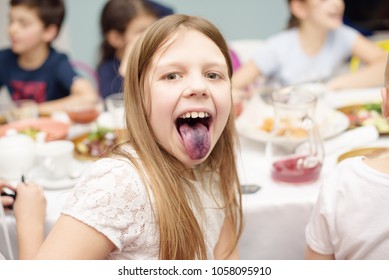 Little Girl Showing Tongue