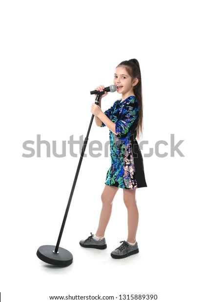 Little Girl Singing Into Microphone On Stock Photo 1315889390 ...