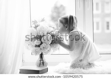 Similar – Florist woman arranges festive bouquet of flowers