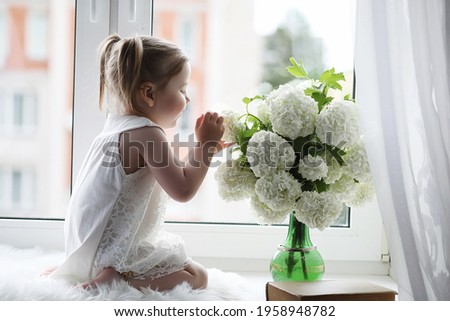 Similar – Florist woman arranges festive bouquet of flowers