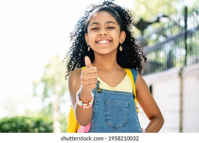 Little Girl Smiling And Showing Thumb Up.