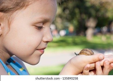 little girl with a snail