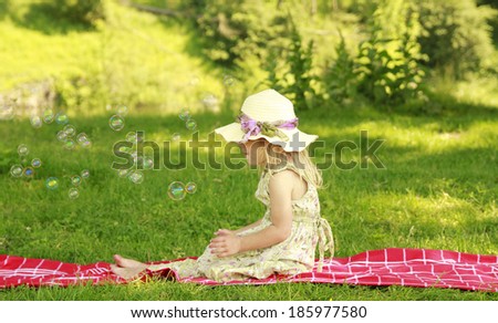 Similar – A boy and a girl in toddlerhood are standing on a log in summer clothes