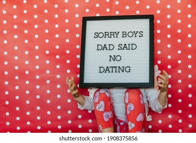 Little Girl Sorry Boys Dad Says No Dating Letter Board Photo With Red Polka Dot Back Drop Heart Valentines Theme Pink Hearts Holding A Sign Valentine Message