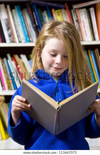 Little Girl Standing Near Bookshelf Stock Photo Edit Now 113667073