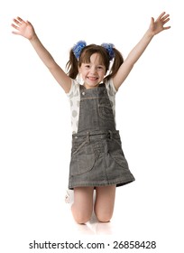 little girl stands on knees and holds hands up, isolated on white