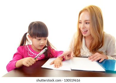 Little Girl Studying In English With Teacher