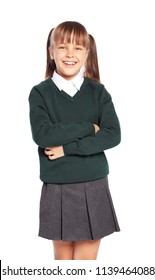 Little girl in stylish school uniform on white background