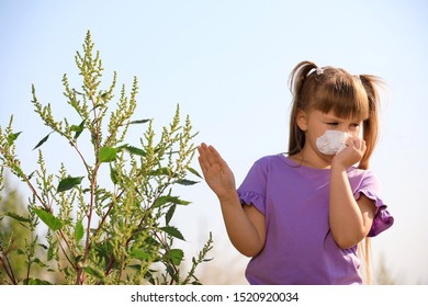 Little Girl Suffering From Ragweed Allergy Outdoors