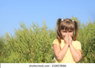 Little Girl Suffering From Ragweed Allergy Outdoors