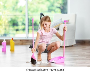 Little Girl Sweeping Floor