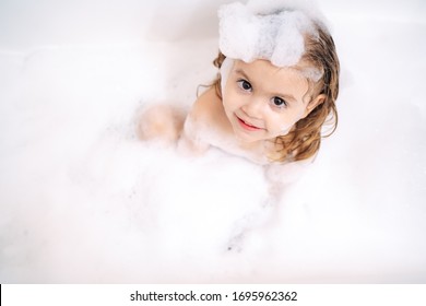 
Little Girl Takes A Bubble Bath