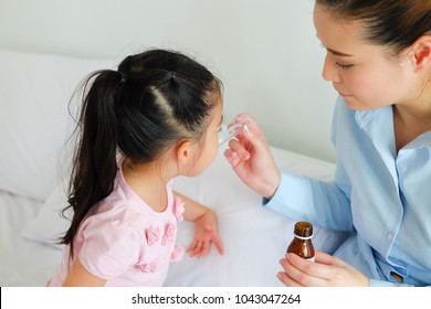 Little Girl Taking Medicine