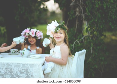 Little Girl Tea Party In A Garden