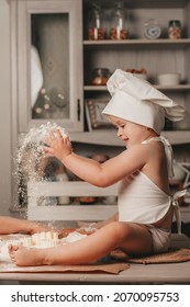 A Little Girl Throwing Flour And Cooking Cookies 