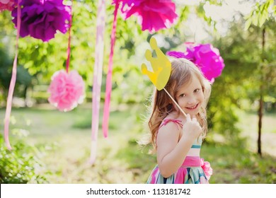 little girl with a toy crown - Powered by Shutterstock