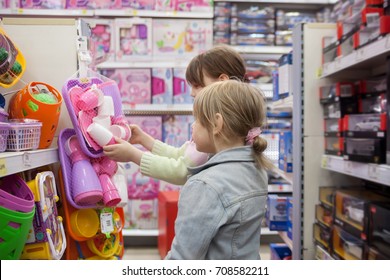 Little Girl In   Toy Store Choosing   Toys