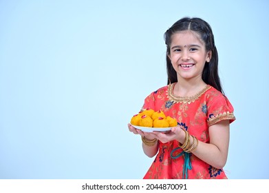 Little Girl In Tradional Clothes Holding Gift Boxes, Diya , Ladoo In Hand, Different Poses, On The Occasion Of Bhaiya Dooj And Diwali Festival ,  Studio Shots