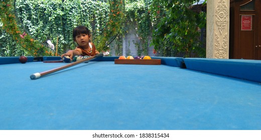 A Little Girl Is Trying To Arrange And Play A Billiard Ball In Colomadu, Karanganyar Regency, Central Java, Indonesia. October 2019, 11:03:24