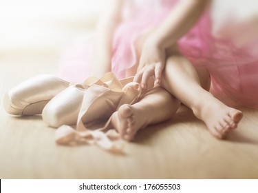 Little Girl Trying On Ballet Shoes