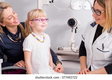 Little Girl Trying On Optic Glasses 