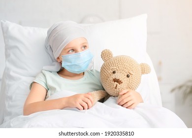 Little girl undergoing course of chemotherapy in clinic - Shutterstock ID 1920335810