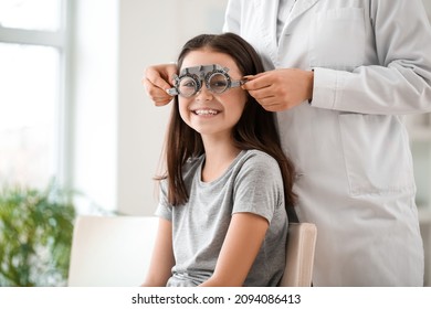 Little girl undergoing eye test in clinic - Powered by Shutterstock