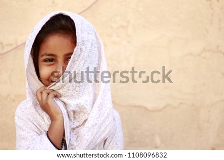 little girl from an underprivileged area of Karachi.