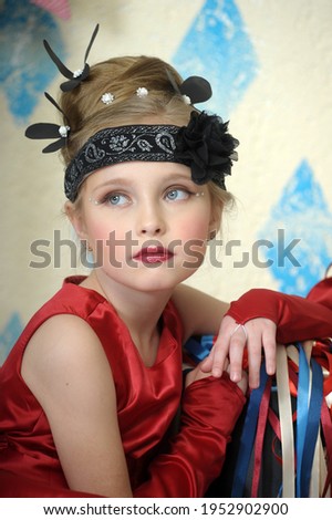 little girl in vintage style in red dress