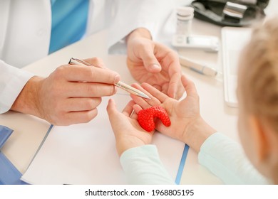 Little Girl Visiting Endocrinologist In Clinic