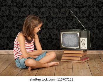 Little Girl Watching Old Retro Tv