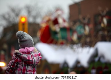 Little Girl Watching Santa At A Santa Claus Parade