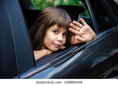 Little Girl Waving Through The Car Window, Goodbye Concept