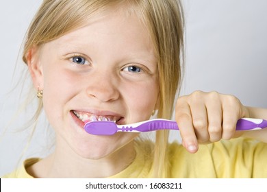 Cute Little Girl Brushing Her Teeth Stock Photo (Edit Now) 1067270501