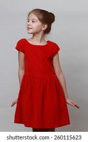 Little Girl Wearing Fashion Red Dress And Dancing