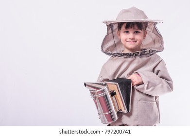 A little girl wears in bee suit in studio white background.
