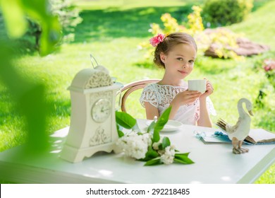 Little Girl With White Cup Outdoor.  People, Children, Tea, Traditions And Time Management Concept. Vintage Style