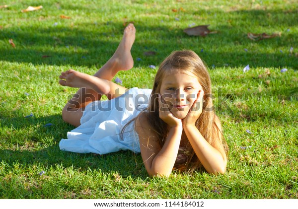 Little Girl White Dress Laying On Stock Photo 1144184012 | Shutterstock