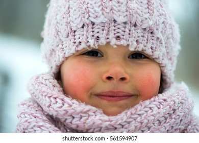 Little Girl In Winter Season With Red Cheeks