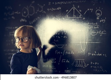 Little Girl Writing Blackboard Concept - Shutterstock ID 496813807