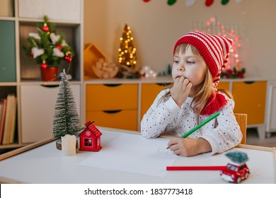 Little Girl Writing A Letter To Santa